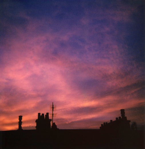 Polaroid sunset roofs Paris France sky